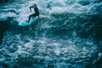Man surfing in sea