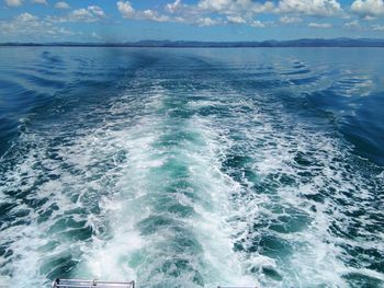 Scenic view of sea against blue sky