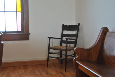 Wooden seats on hardwood floor in church