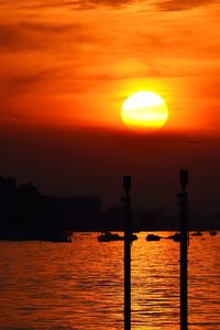 Scenic view of sea against orange sky