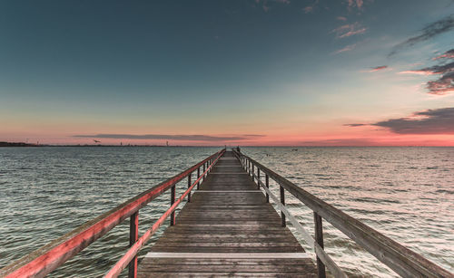 Scenic view of sea against clear sky during sunset