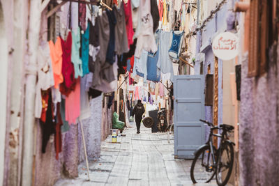 Bicycles hanging on footpath in city