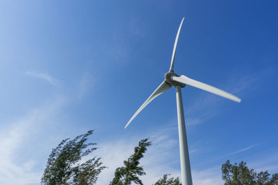 Low angle view of wind turbine against sky