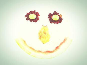 Close-up of multi colored balloons on white background