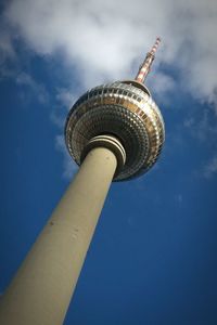 Low angle view of communications tower against sky