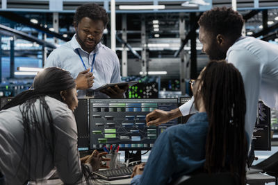Rear view of woman standing in city