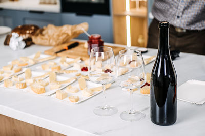 Close-up of wineglasses on table