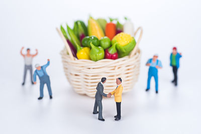 Close-up of vegetables on table against white background