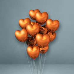 Close-up of multi colored balloons against white background