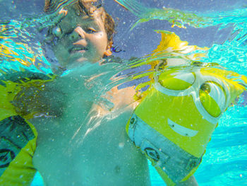 High angle view of man swimming in pool