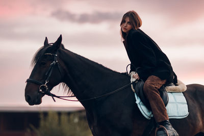 Woman riding horse