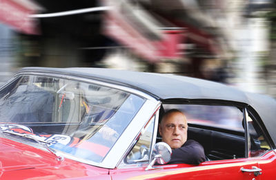 Man driving vintage car