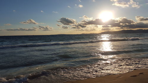 Scenic view of sea at sunset