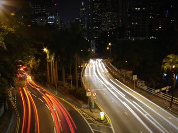 High angle view of light trails on road at night