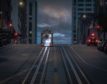 Illuminated city street at night