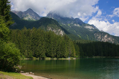 Scenic view of lake and mountains against sky