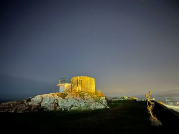 Scenic view of sea against sky at night