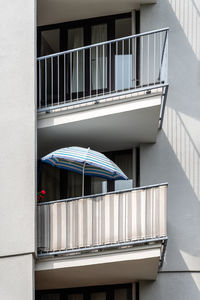 Detail of a umbrella on the balcony of an apartment building in berlin.