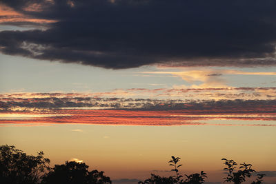 Scenic view of dramatic sky during sunset