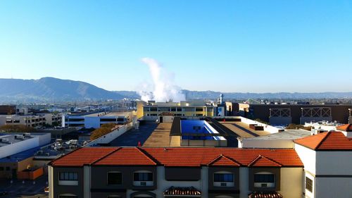 Residential buildings against blue sky