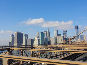 View of bridge and buildings against sky