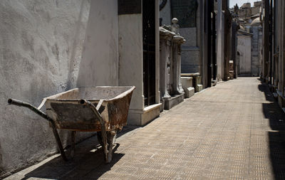 Empty alley amidst buildings in city