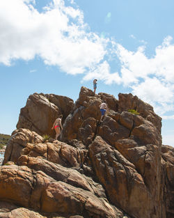 Low angle view of rock formation against sky