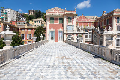 Footpath amidst buildings in town