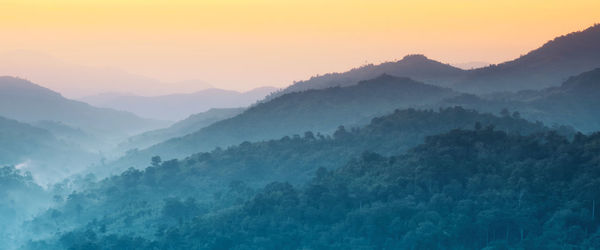 Scenic view of mountains against sky during sunset