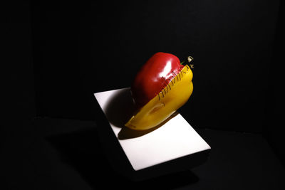 High angle view of apple on table against black background