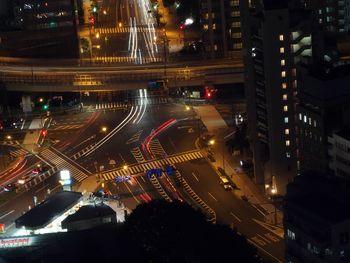 High angle view of light trails on road in city