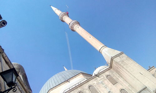 Low angle view of building against blue sky