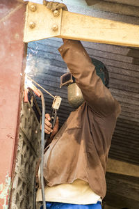 Man working on metal