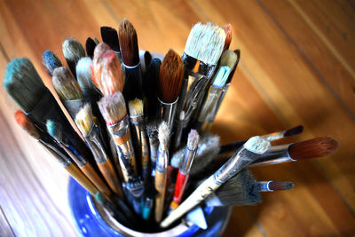 Overhead view of paintbrushes on table