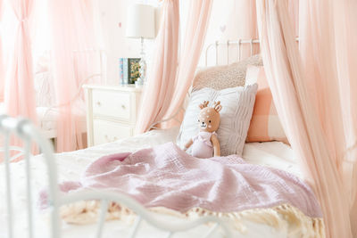 Little girl bed with stuffed animal