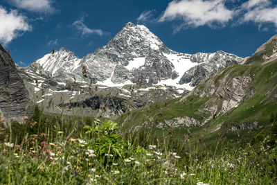 Scenic view of snowcapped mountains against sky