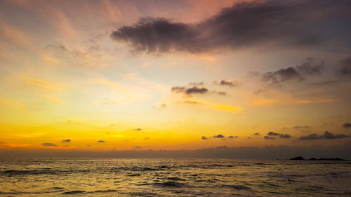 Scenic view of sea against romantic sky at sunset