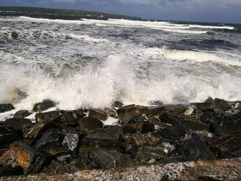 Waves splashing on rocks