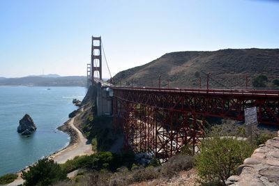 Bridge over sea against sky