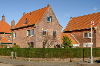 House-shaped housing development with traditional brick architecture from the 1930's