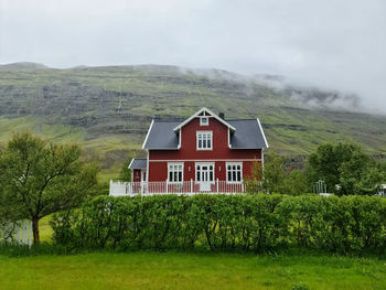 House on field against sky