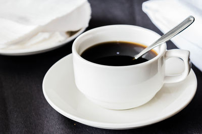 Close-up of coffee cup on table