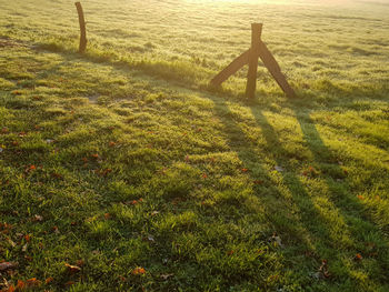 High angle view of wooden post on field