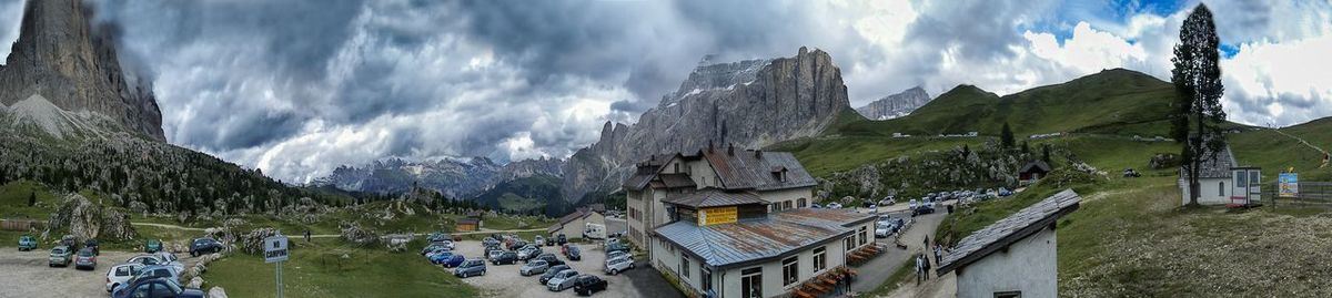 Panoramic view of buildings and mountains against sky