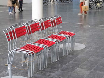 Empty deck chairs in water