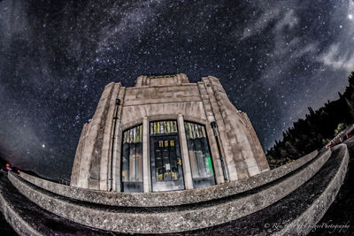 Low angle view of building against sky at night