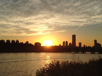 Silhouette of city at sunset