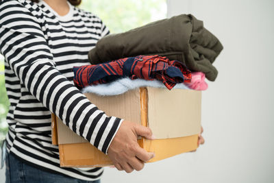 Midsection of woman holding gift box