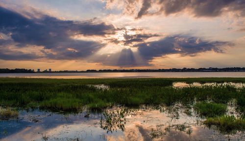 Scenic view of landscape against cloudy sky