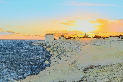 Scenic view of beach against sky during sunset